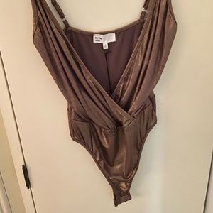 by the way. Gold Bodysuit